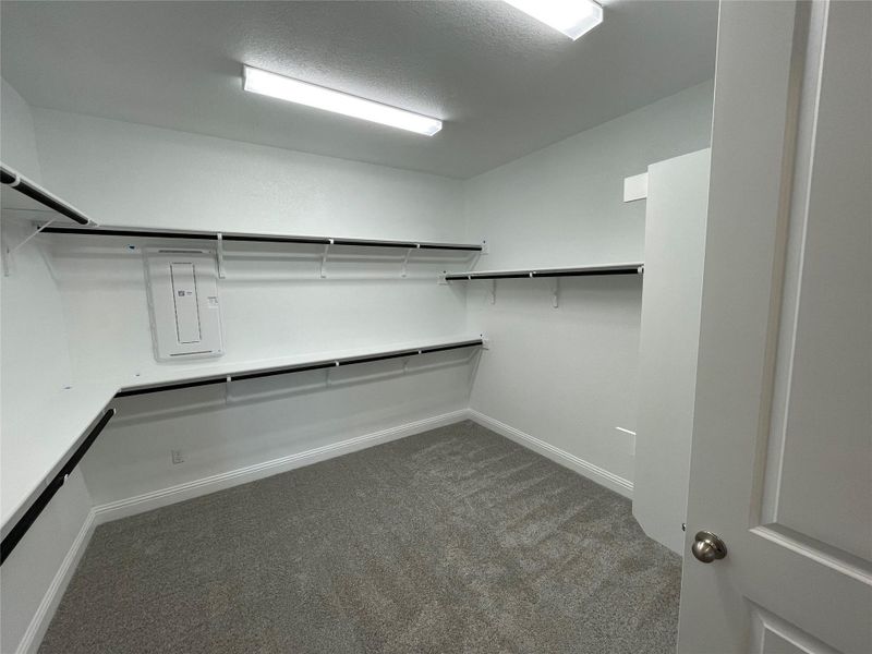 Walk-in closet in Primary Bedroom Walk-in closet in Primary Bedroom