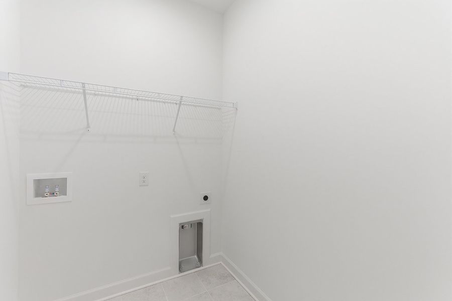 A white wall with a vent.