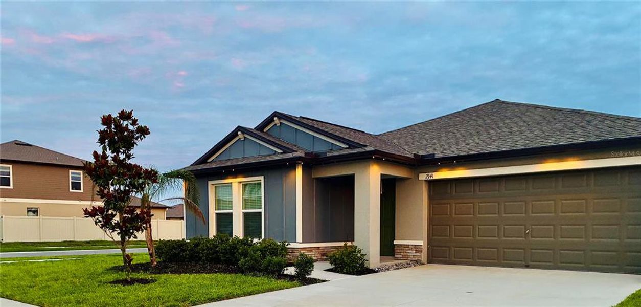 Front exterior of a new home in Two Rivers, Zephyrhills, FL, highlighting curb appeal (Image 20).
