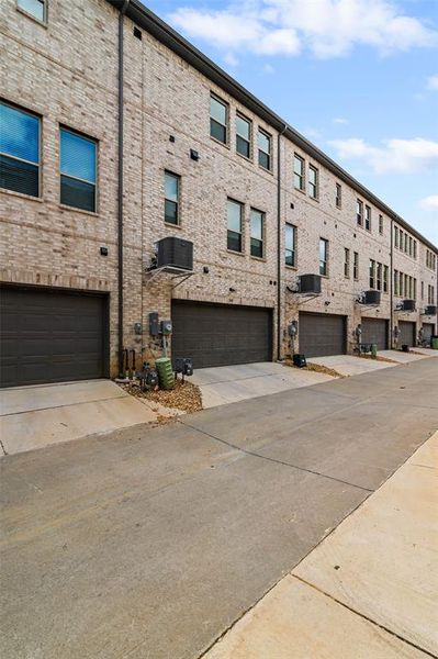 View of building exterior featuring a garage