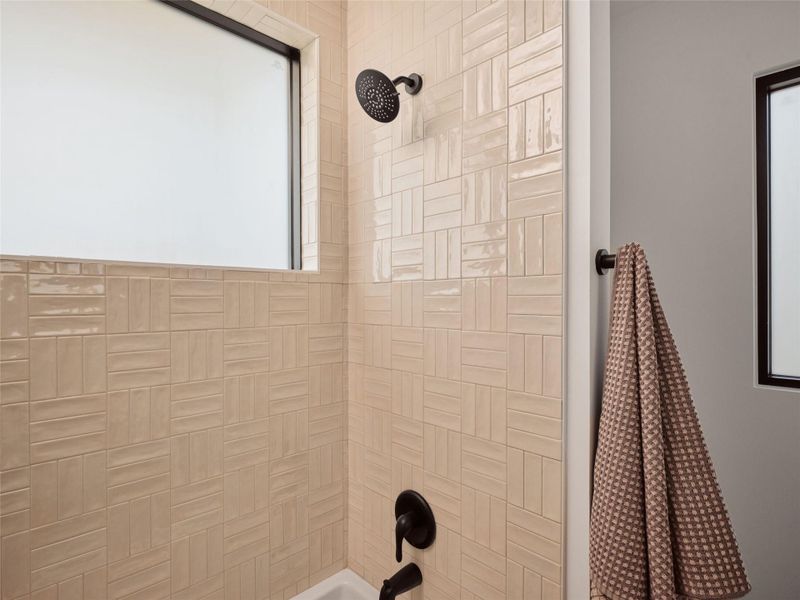 Bathroom view of bathing tub / shower combination