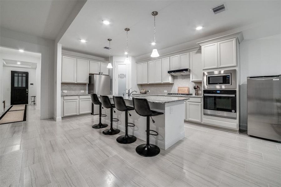 GOURMET KITCHEN WITH PENDANT LIGHTING AND BUILT-INS (SINGLE OVEN OFFERS AIR FRY, CONVECTION, WIFI CONTROL AND SO MUCH MORE)