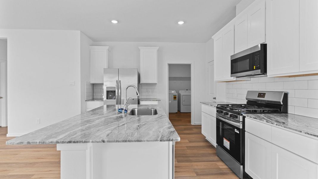 Representative furnished interior of a home built from the Hanna by D.R. Horton in Caldwell Crossing, Iowa Colony (Image 5).