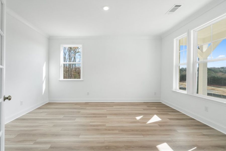 Representative unfurnished interior of a home built from the Ingram by Taylor Morrison in Falls Creek, Flowery Branch (Image 28).