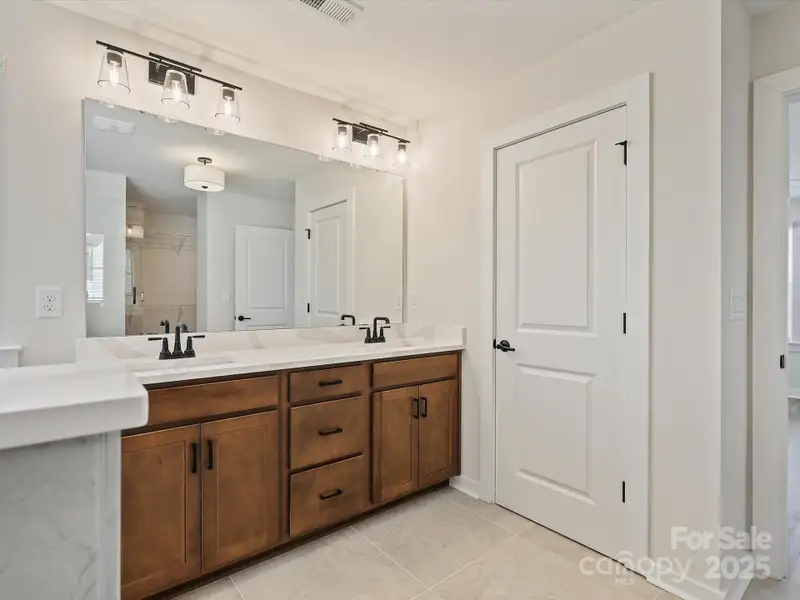 Furnished interior in a model home at The River District - Pioneer Collection in Charlotte (Image 4).