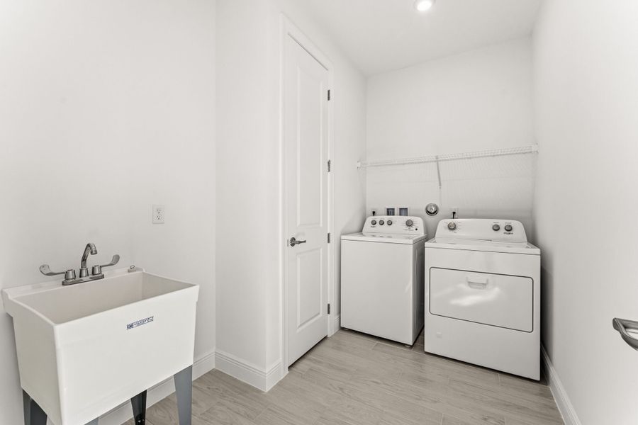 Furnished interior view inside a new home in Newfield - Rosette Park, Palm City (Image 11).