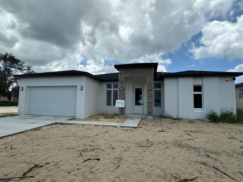 Front exterior of a new home in , Kissimmee, FL, highlighting curb appeal (Image 18). Front exterior of a new home in , Kissimmee, FL, highlighting curb appeal (Image 18).