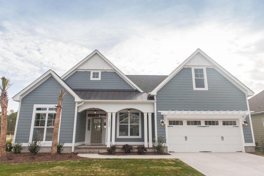 Representative exterior photo of a completed home built from the Helmsley by Bill Clark Homes in The Sanctuary at Sunset Beach, Sunset Beach, NC (Image 22). Representative exterior photo of a completed home built from the Helmsley by Bill Clark Homes in The Sanctuary at Sunset Beach, Sunset Beach, NC (Image 22).