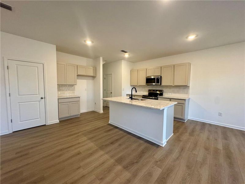 Furnished interior view inside a new home in Eastlyn Crossing, Flowery Branch (Image 7).
