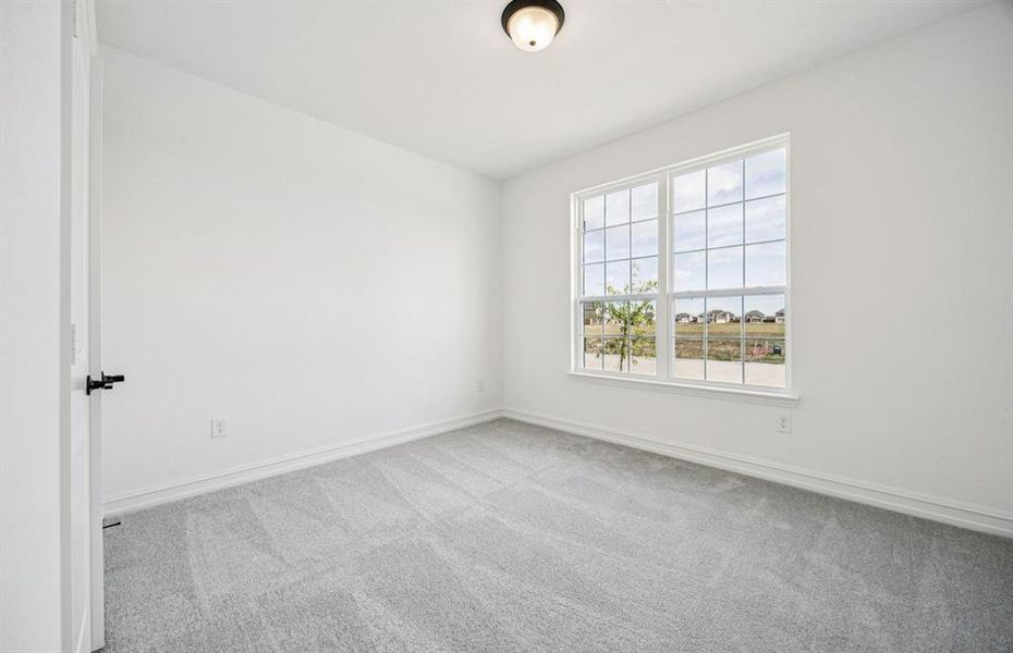 Spacious secondary bedroom with large windows Spacious secondary bedroom with large windows