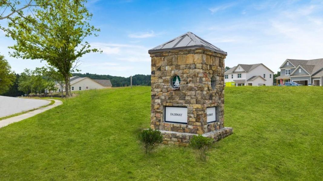 Front exterior of a new home in Fairway 17 at Mirror Lake, Villa Rica, GA, highlighting curb appeal (Image 12).
