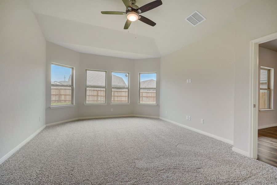 Primary suite bedroom in the Pearl floorplan at a Meritage Homes community.