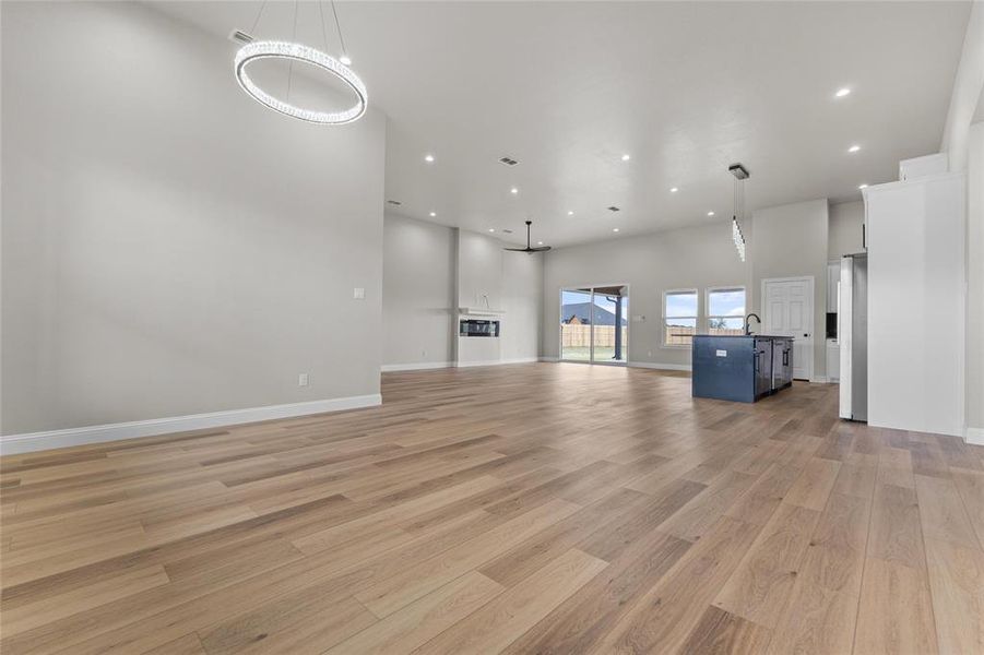 Unfurnished living room with light wood-style floors and recessed lighting