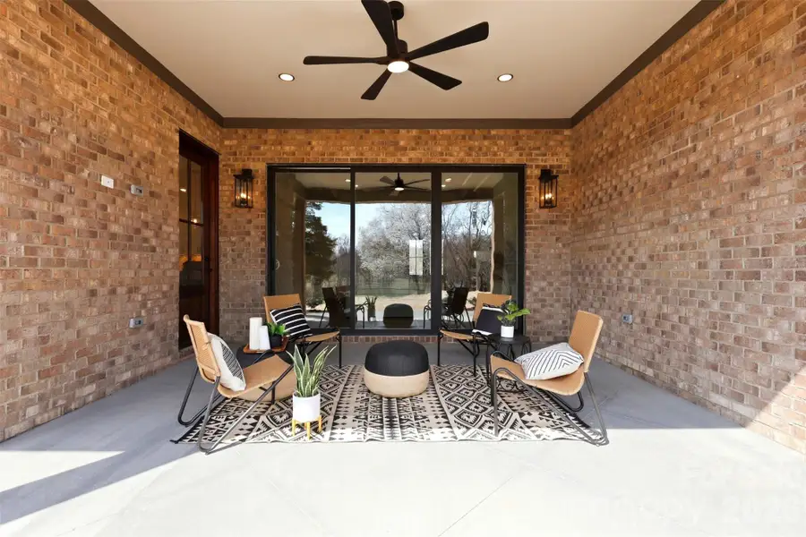 covered rear porch- great for outdoor entertaining or simply taking in the picturesque country views!