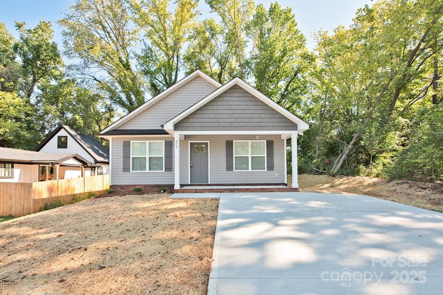 Front exterior of a new home in , Concord, NC, highlighting curb appeal (Image 12). Front exterior of a new home in , Concord, NC, highlighting curb appeal (Image 12).