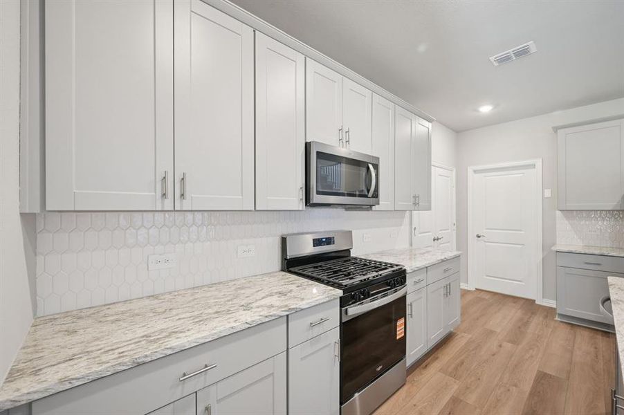 Furnished interior view inside a new home in Eastridge - Spring Series, McKinney (Image 11). Furnished interior view inside a new home in Eastridge - Spring Series, McKinney (Image 11).