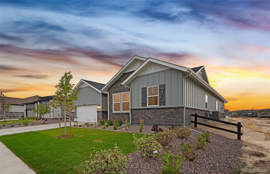 Front exterior of a new home in Hilltop at Inspiration, Aurora, CO, highlighting curb appeal (Image 2).