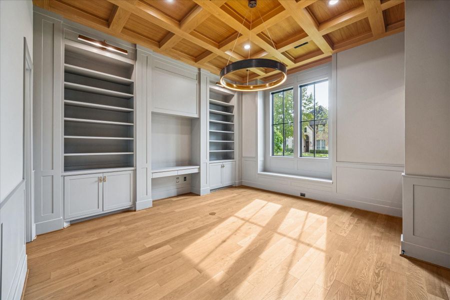 Crisp architectural detailing defines this study and anchor the room with symmetry and purpose. Built-in bookcases with integrated picture lights create a warm, library-like atmosphere, while the window seat introduces a comfortable spot to read or unwind with natural light pouring in. The generous scale allows for a substantial desk and seating area without sacrificing flow. Thoughtful craftsmanship and refined finishes make this a standout workspace that feels both inspiring and beautifully grounded. Crisp architectural detailing defines this study and anchor the room with symmetry and purpose. Built-in bookcases with integrated picture lights create a warm, library-like atmosphere, while the window seat introduces a comfortable spot to read or unwind with natural light pouring in. The generous scale allows for a substantial desk and seating area without sacrificing flow. Thoughtful craftsmanship and refined finishes make this a standout workspace that feels both inspiring and beautifully grounded.