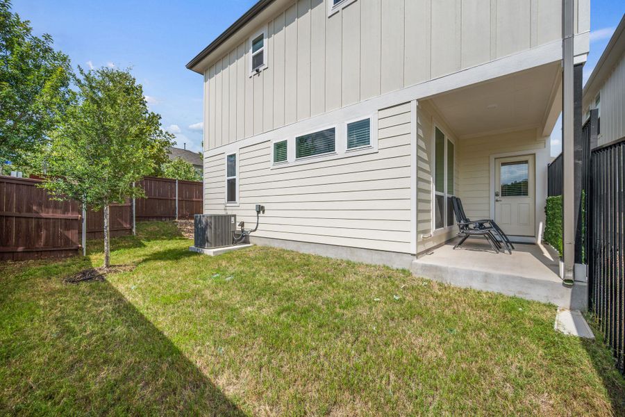 Exterior details and patio area of a home in Messinger Village, Austin (Image 3).