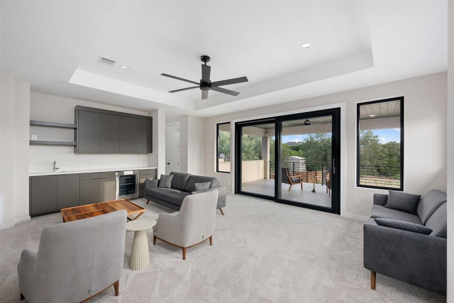 Enjoy entertaining with wet bar, wine/drink refrigerator, and Rehau sliding doors to covered deck. Enjoy entertaining with wet bar, wine/drink refrigerator, and Rehau sliding doors to covered deck.