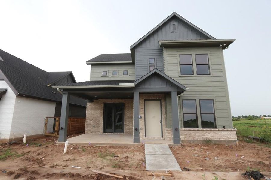 Front exterior of a new home in Indigo 50’ Homesites, Richmond, TX, highlighting curb appeal (Image 8). Front exterior of a new home in Indigo 50’ Homesites, Richmond, TX, highlighting curb appeal (Image 8).