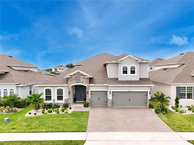 Front exterior of a new home in , Clermont, FL, highlighting curb appeal (Image 28). Front exterior of a new home in , Clermont, FL, highlighting curb appeal (Image 28).