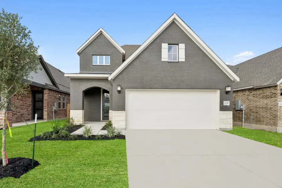 Front exterior of a new home in Mayfair - Select Garden Series, New Braunfels, TX, highlighting curb appeal (Image 1). Front exterior of a new home in Mayfair - Select Garden Series, New Braunfels, TX, highlighting curb appeal (Image 1).