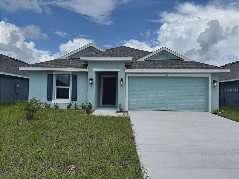 Front exterior of a new home in Watercress Cove, North Port, FL, highlighting curb appeal (Image 1). Front exterior of a new home in Watercress Cove, North Port, FL, highlighting curb appeal (Image 1).
