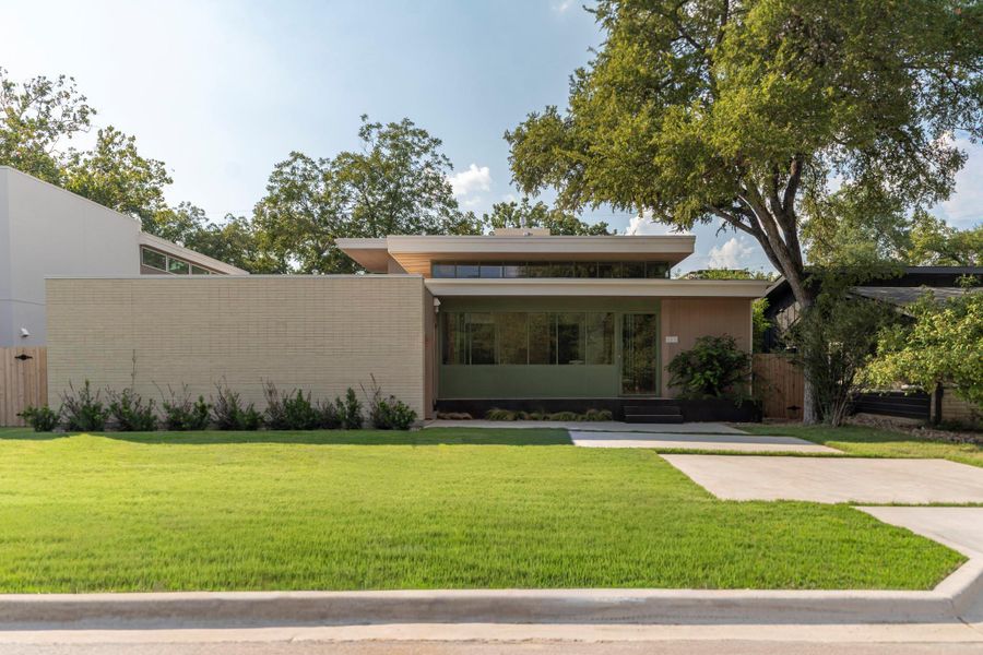 Front exterior of a new home in , Austin, TX, highlighting curb appeal (Image 1). Front exterior of a new home in , Austin, TX, highlighting curb appeal (Image 1).