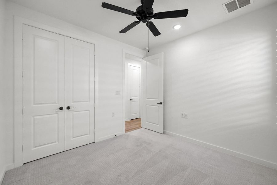 Each room has recessed lighting and a ceiling fan.