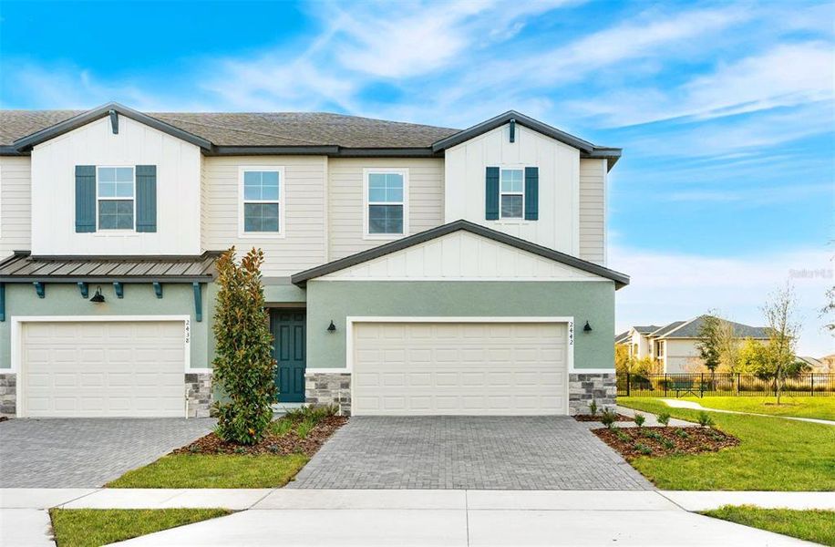Front exterior of a new home in Magnolia Reserve, Ocoee, FL, highlighting curb appeal (Image 14).