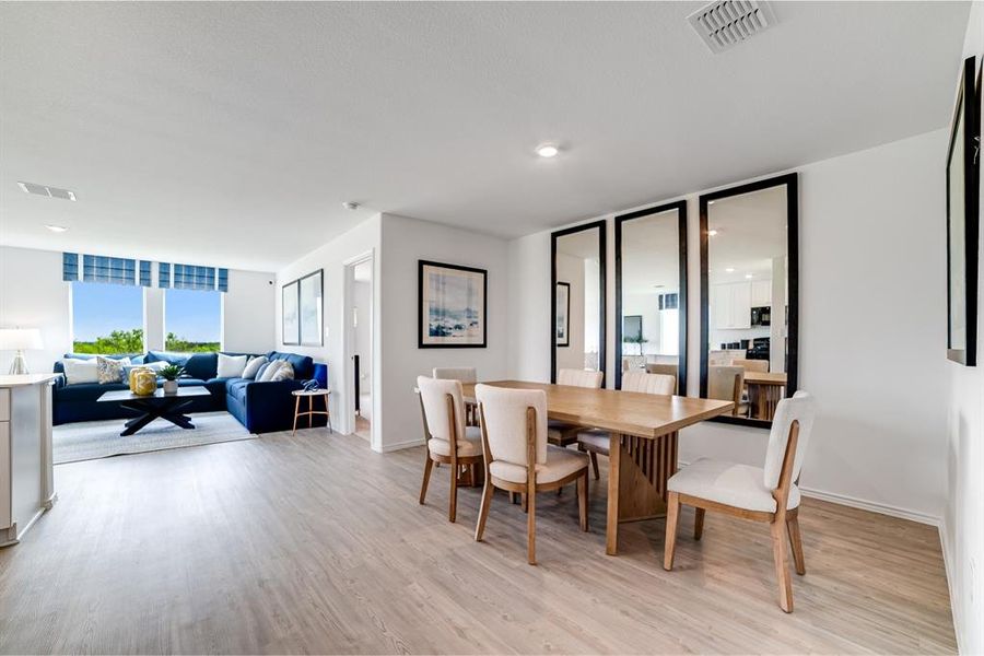 Dining space with light wood finished floors and baseboards Dining space with light wood finished floors and baseboards