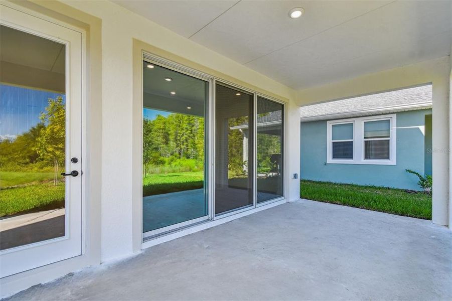 Exterior details and patio area of a home in Chapel Crossings - Garden Series, Wesley Chapel (Image 4).