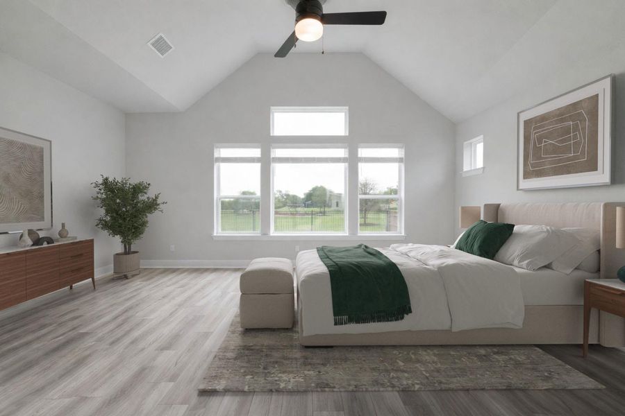 Vaulted ceiling room featuring multiple windows, a ceiling fan with integrated lighting, and wood-finish flooring