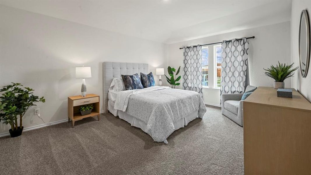 Carpeted bedroom featuring baseboards Carpeted bedroom featuring baseboards