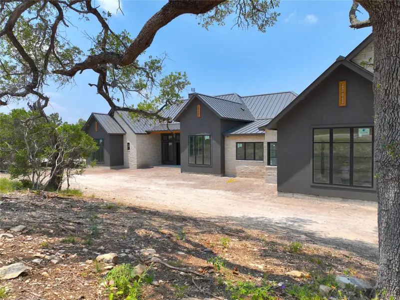 Front exterior of a new home in , Canyon Lake, TX, highlighting curb appeal (Image 11). Front exterior of a new home in , Canyon Lake, TX, highlighting curb appeal (Image 11).