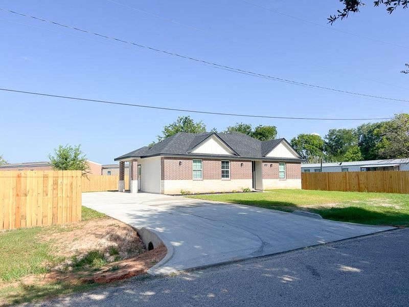 Front of Home Showing New Fencing and Driveway for Multiple Vehicles. City Maintained Asphalt Road. Front of Home Showing New Fencing and Driveway for Multiple Vehicles. City Maintained Asphalt Road.