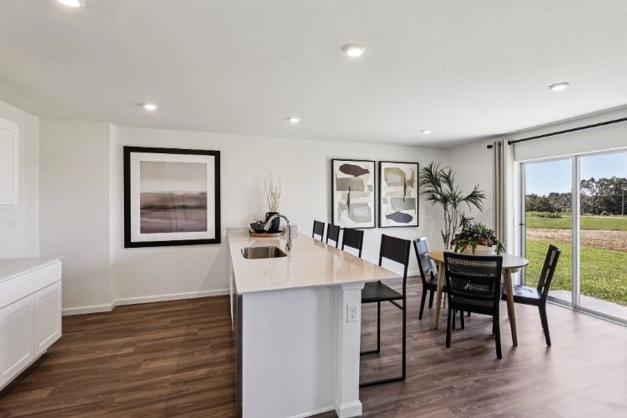 A kitchen with a dining table. A kitchen with a dining table.