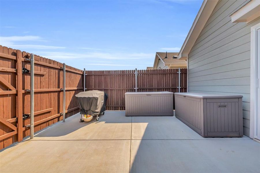 Fenced backyard featuring a patio area