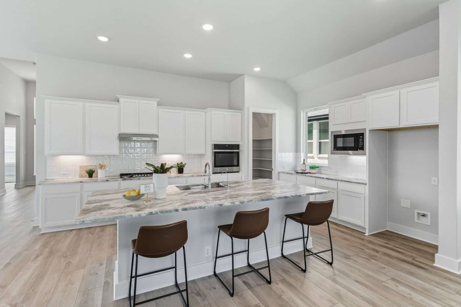 Representative furnished interior of a home built from the Hampton by Chesmar Homes in Buffalo Crossing, Cibolo (Image 5).