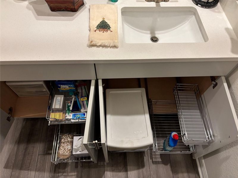Bathroom view of a sink and washer / clothes dryer