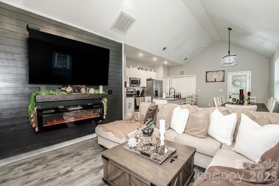 Living room with view of the kitchen and the dining area