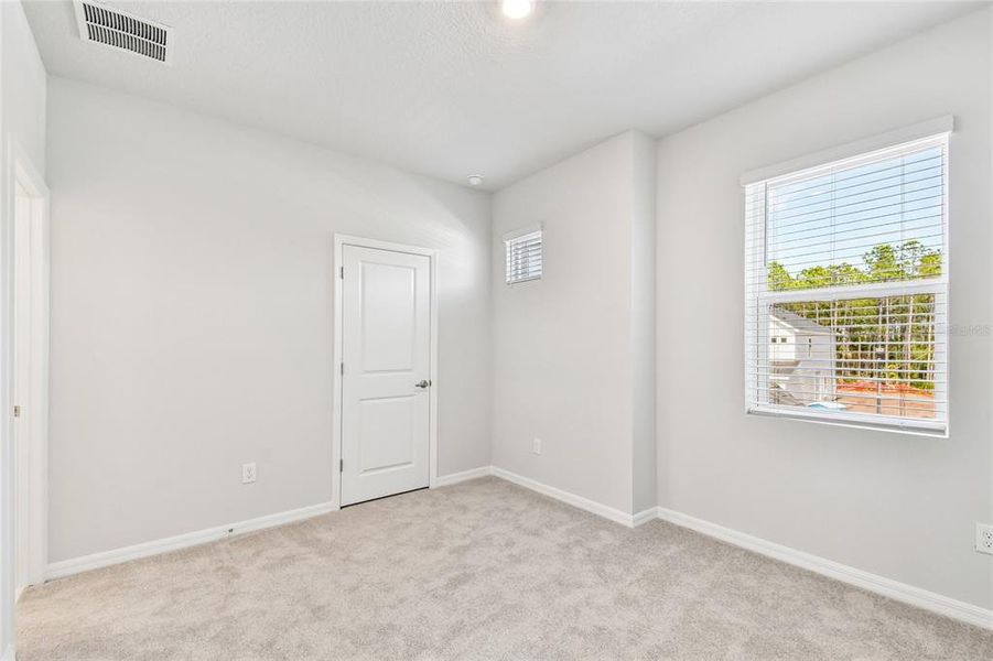 Spacious, unfurnished interior of a new home in Preserve at The Cays – The Driftwood Series, Daytona Beach (Image 25). Spacious, unfurnished interior of a new home in Preserve at The Cays – The Driftwood Series, Daytona Beach (Image 25).