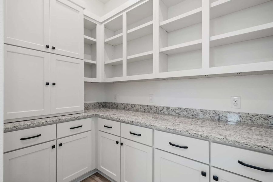 Representative furnished interior of a home built from the Malibu by Chesmar Homes in Fulshear Lakes, Fulshear (Image 11).