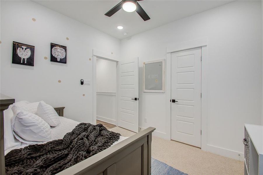 Secondary bedroom on the third floor! Photos from another community by the same builder, FINISHES & FLOOR PLAN WILL VARY! Ceiling fans are not included!