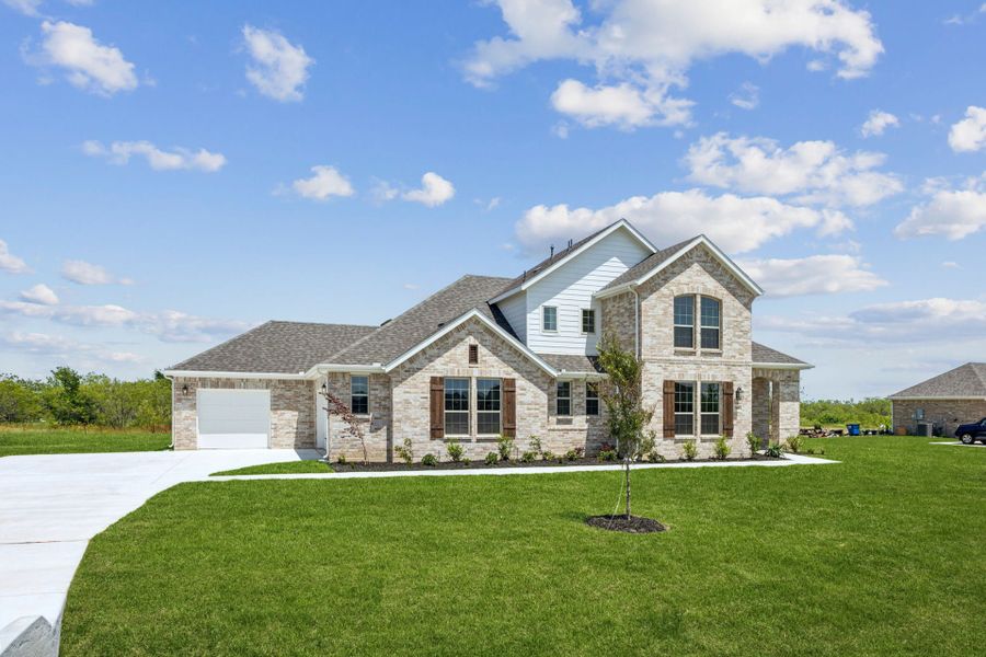 Front exterior of a new home in Ellis Ranch Estates, Waxahachie, TX, highlighting curb appeal (Image 20). Front exterior of a new home in Ellis Ranch Estates, Waxahachie, TX, highlighting curb appeal (Image 20).