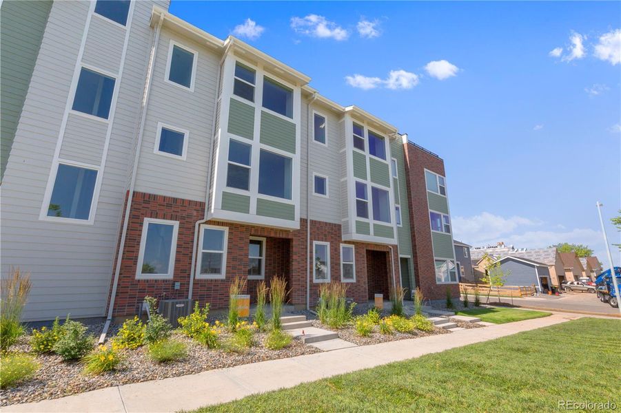 Front exterior of a new home in Dillon Pointe - Skyview, Broomfield, CO, highlighting curb appeal (Image 17).