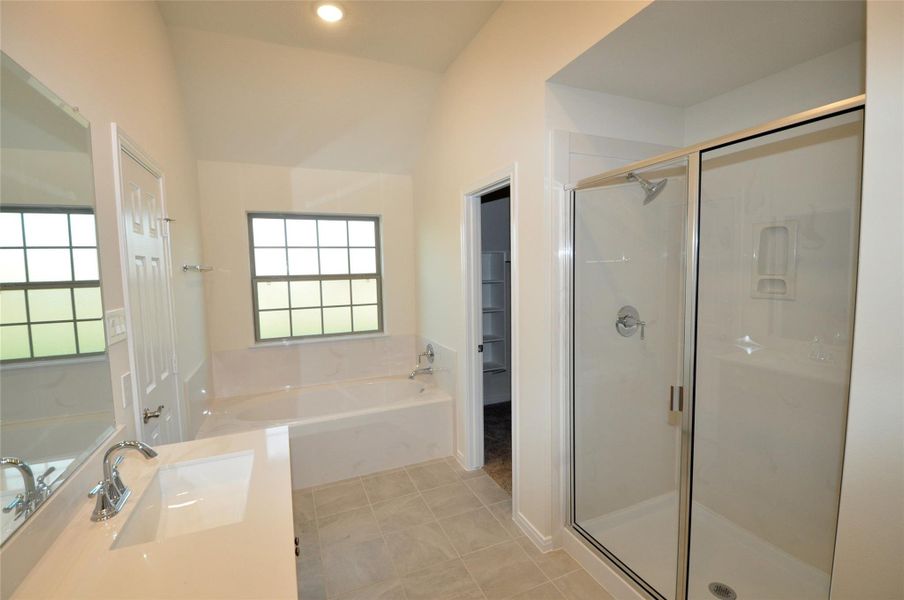 Separate and spacious soaking tub and shower in master bath.