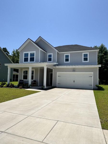 Front exterior of a new home in Heron's Walk at Summers Corner: Arbor Collection, Summerville, SC, highlighting curb appeal (Image 24).