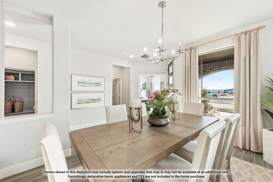 Dining room with wood table, white chairs, chandelier, and large window with curtains Dining room with wood table, white chairs, chandelier, and large window with curtains